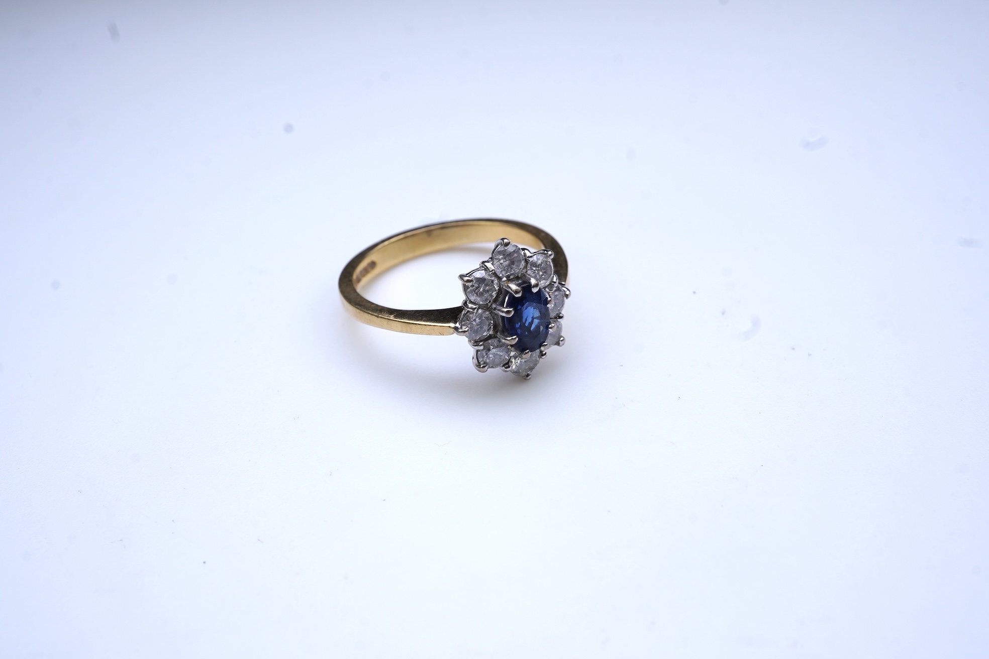 A sapphire and diamond cluster ring